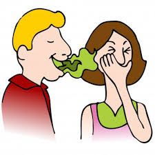 Cartoon of a boy and girl with a piece of broccoli between them