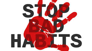 Text 'STOP BAD HABITS' with red boxing glove graphic on a white background