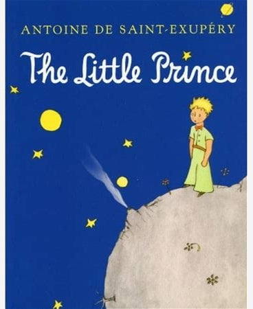 The front cover of the book 'The Little Prince' by Antoine de Saint-Exupéry, featuring a deep blue night sky with yellow stars and moons, a small illustrated prince in a green dress standing on a gray rock, and the title in large white script.